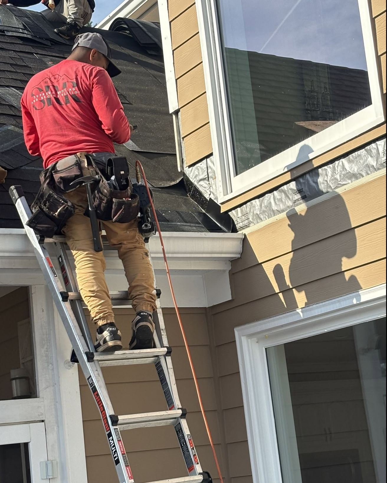 Supreme Roofing crew installing gutters in Columbus, Muscogee County GA